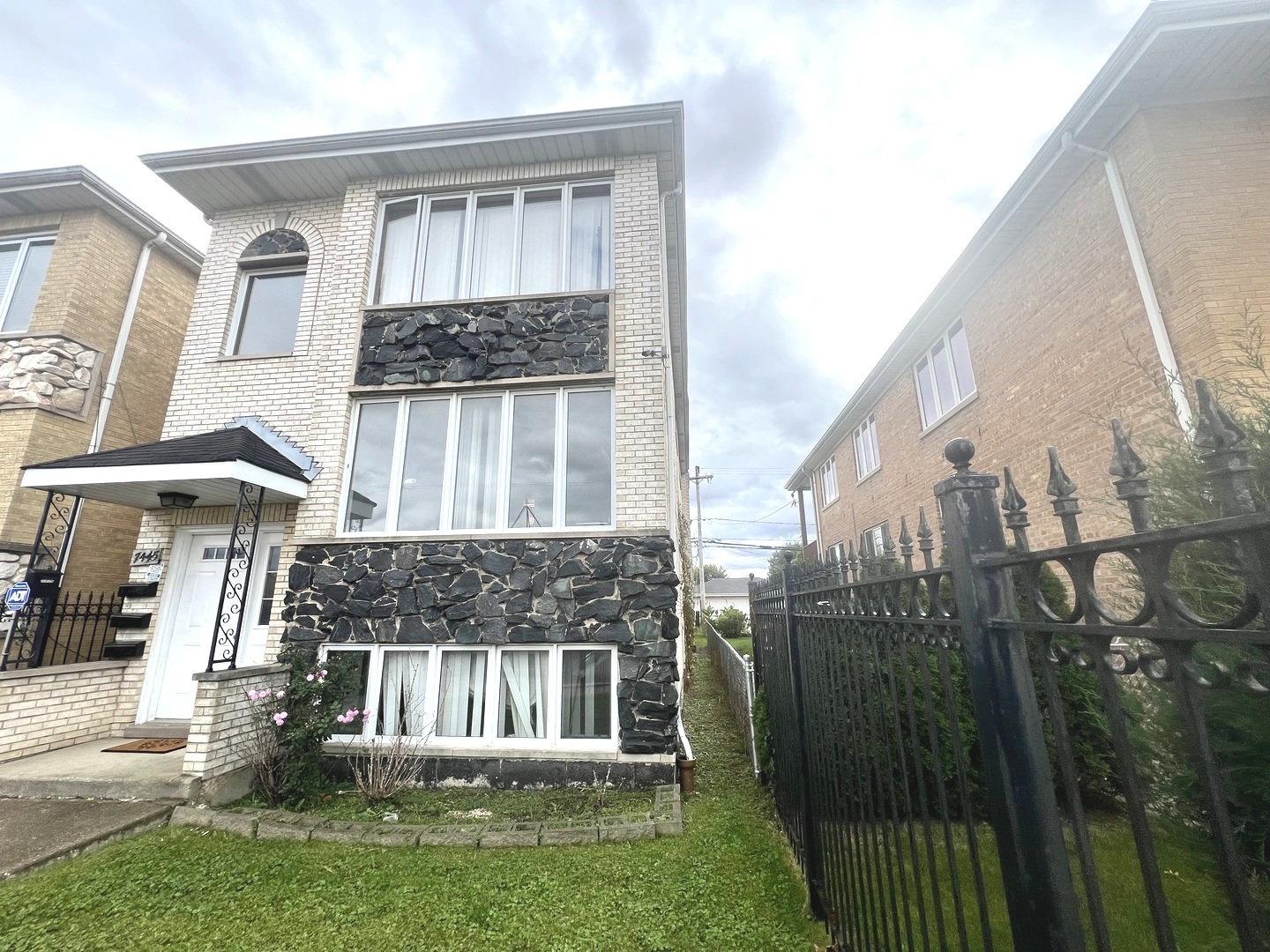 7445 West Belmont Avenue, Unit 1 Chicago, IL 60634 - Photo 1 of 20 a view of a house with a yard