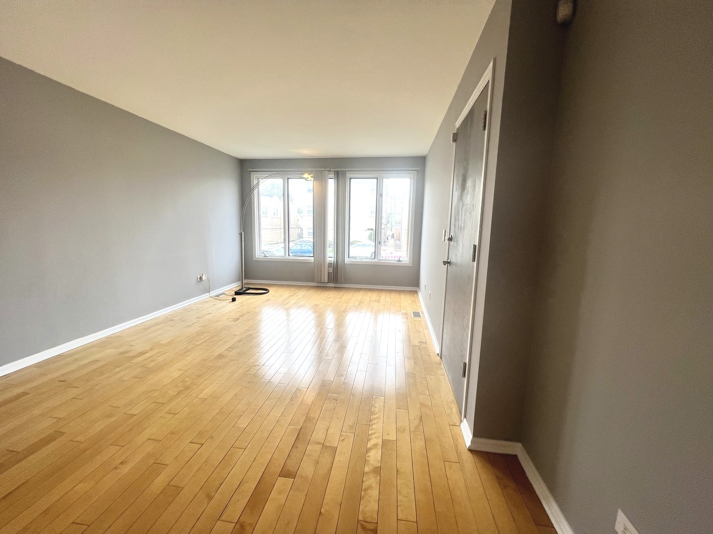 7445 West Belmont Avenue, Unit 1 Chicago, IL 60634 - Photo 7 of 20 wooden floor in a room next to a window