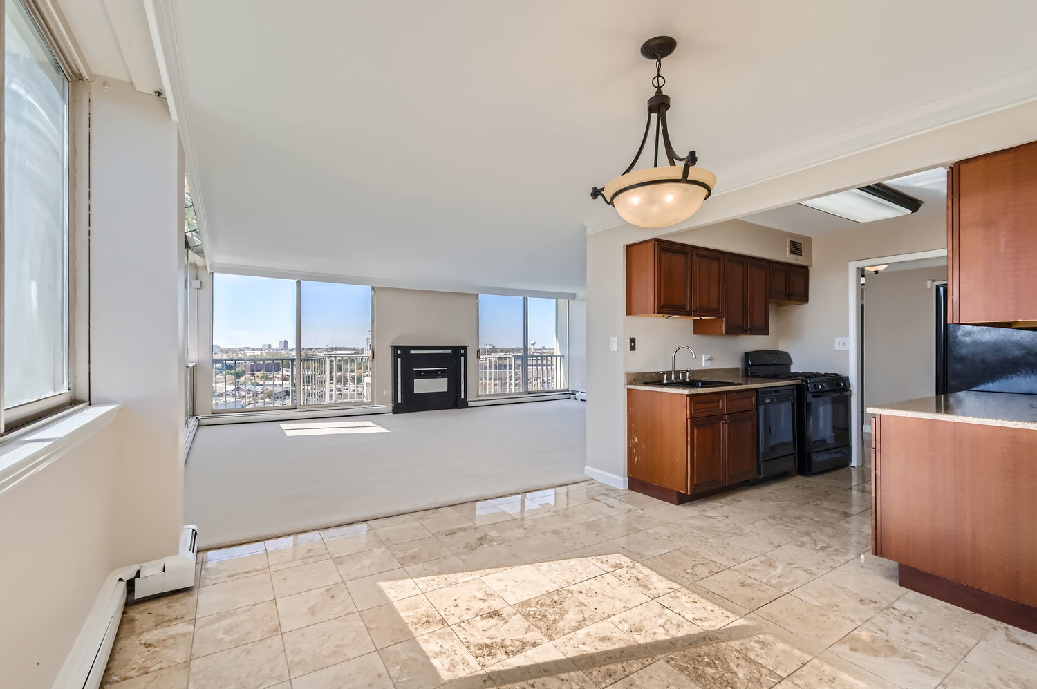 20 North Tower Road, Unit 12M Oak Brook, IL 60523 - Photo 11 of 28 a kitchen with granite countertop a stove top oven a sink dishwasher a refrigerator and a oven with wooden floor