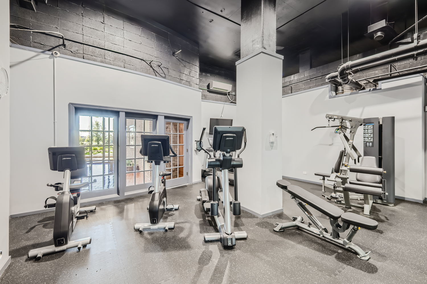 20 North Tower Road, Unit 12M Oak Brook, IL 60523 - Photo 23 of 28 a view of a room with gym equipment