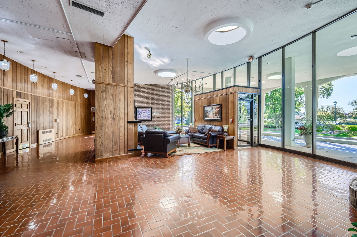 20 North Tower Road, Unit 12M Oak Brook, IL 60523 - Photo 4 of 28 a view of a livingroom with furniture water view and large windows