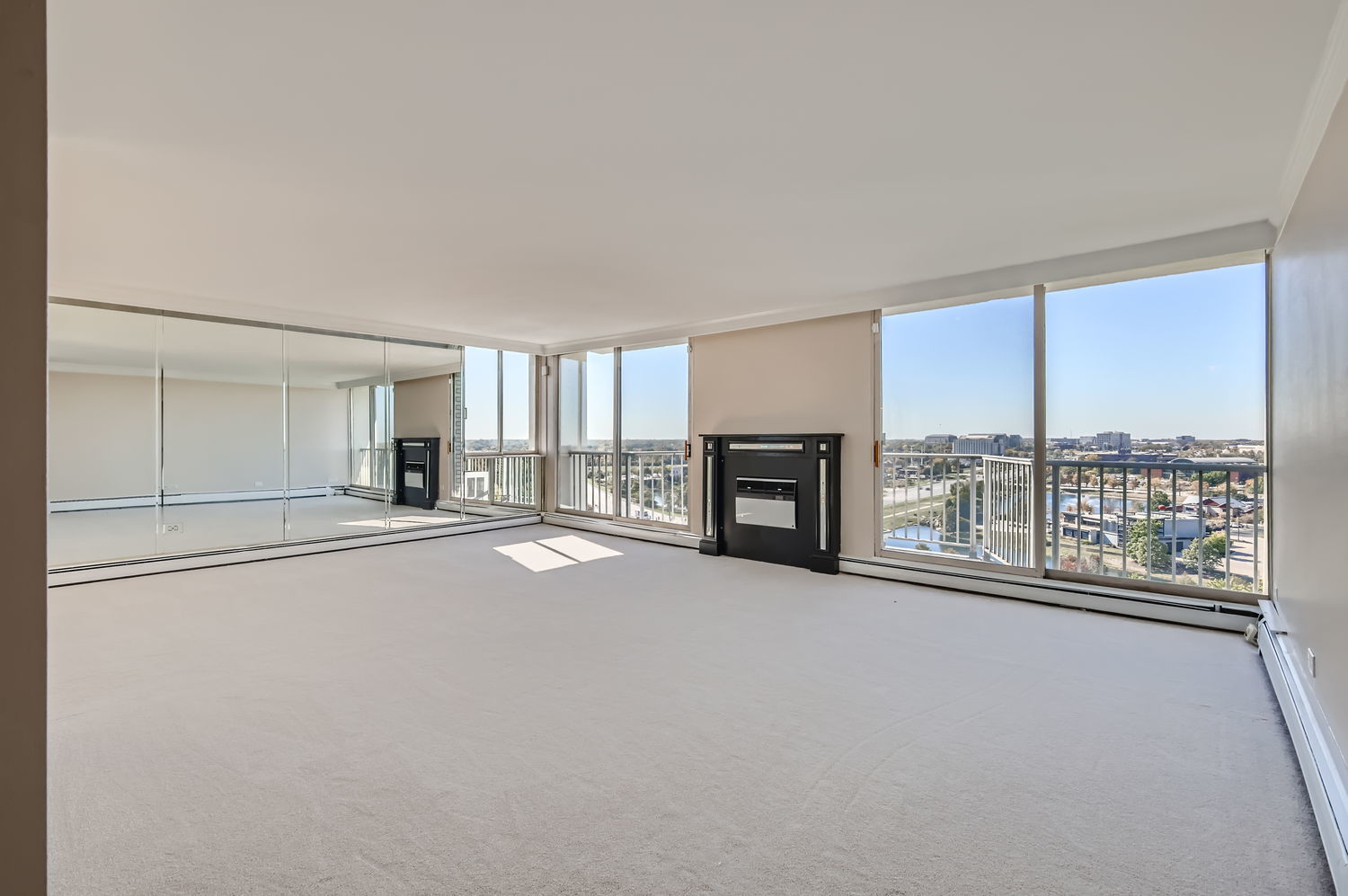 20 North Tower Road, Unit 12M Oak Brook, IL 60523 - Photo 7 of 28 an empty room with fireplace and windows