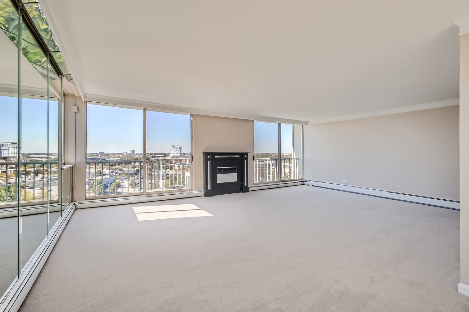 20 North Tower Road, Unit 12M Oak Brook, IL 60523 - Photo 8 of 28 a view of an empty room with a fireplace