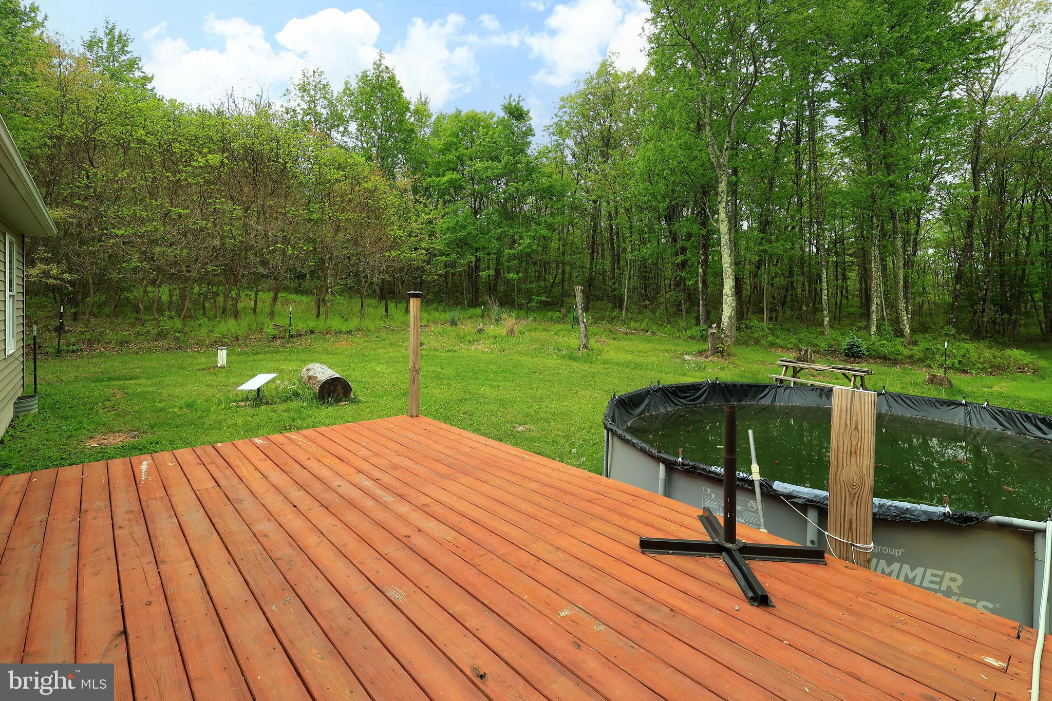 358 Buckridge Road Howard, PA 16841 - Photo 35 of 40 a view of a backyard with a garden and seating area