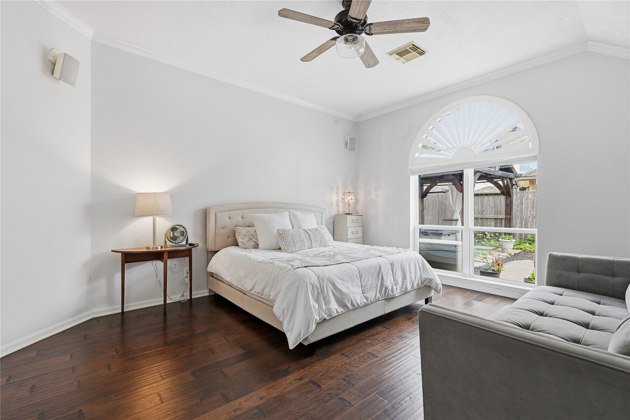 1010 Bringewood Chase Drive Spring, TX 77379 - Photo 22 of 49 Primary suite with wood floors and sunset arched shutter
