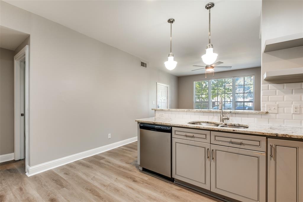 3912 Rawlins Street, Unit 2 Dallas, TX 75219 - Photo 12 of 25 a kitchen with a sink and window