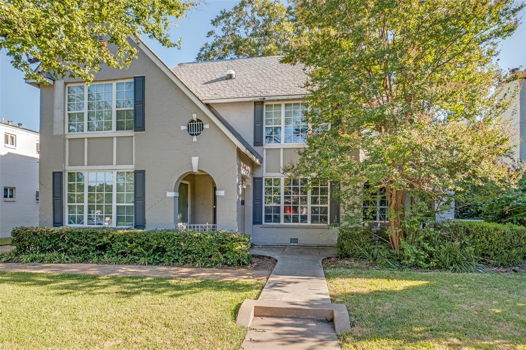 3912 Rawlins Street, Unit 2 Dallas, TX 75219 - Photo 2 of 25 a front view of a house with a yard