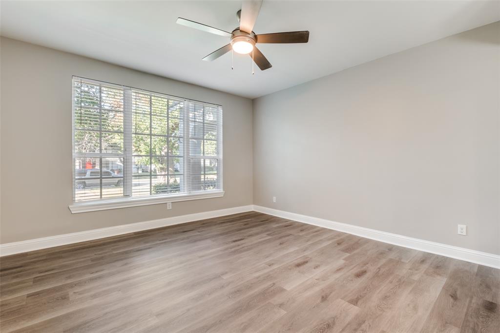 3912 Rawlins Street, Unit 2 Dallas, TX 75219 - Photo 5 of 25 wooden floor in an empty room with a window