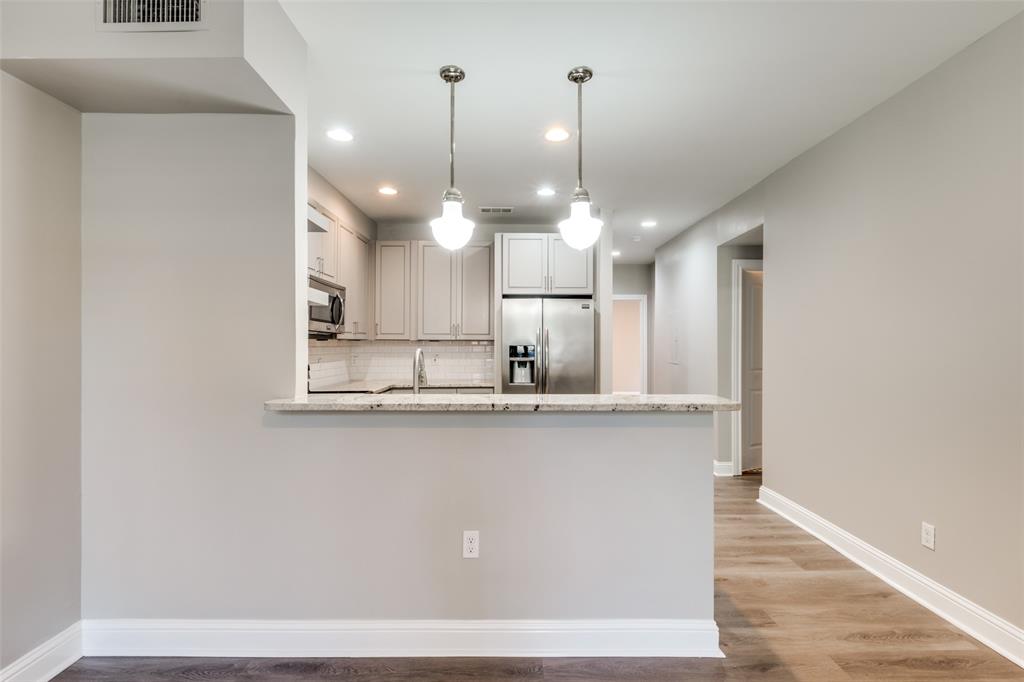 3912 Rawlins Street, Unit 2 Dallas, TX 75219 - Photo 9 of 25 a view of a kitchen with a sink and window