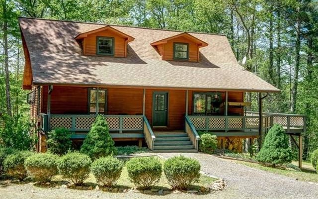 106 Ledford Estates Road Murphy, NC 28906 - Photo 1 of 4 a front view of a house with garden