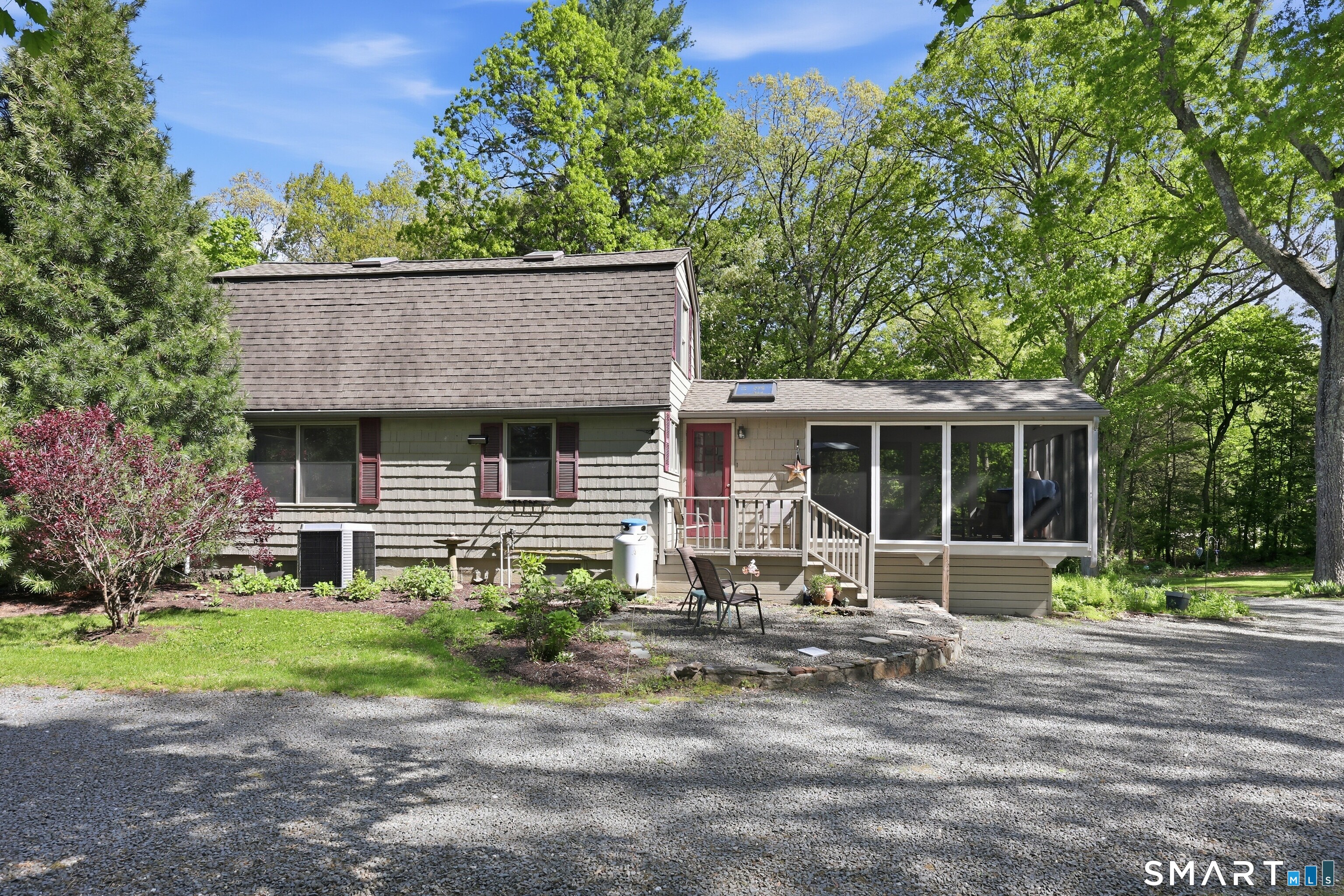 174 Canton Road Granby, CT 06035 - Photo 27 of 35 a front view of a house with garden