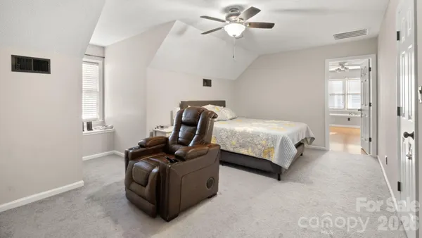 a bedroom with bed and window