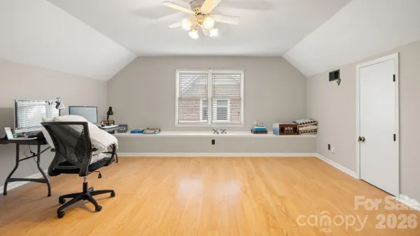 a living room with a couch and a chandelier
