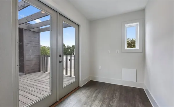 a view of an entryway with wooden floor