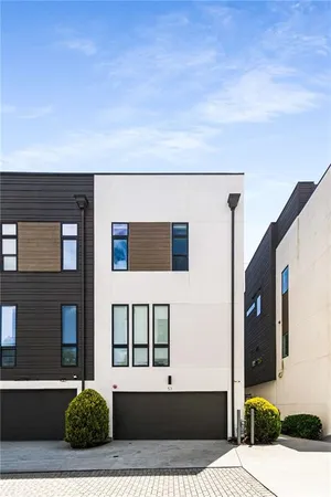 a view of house with car parked
