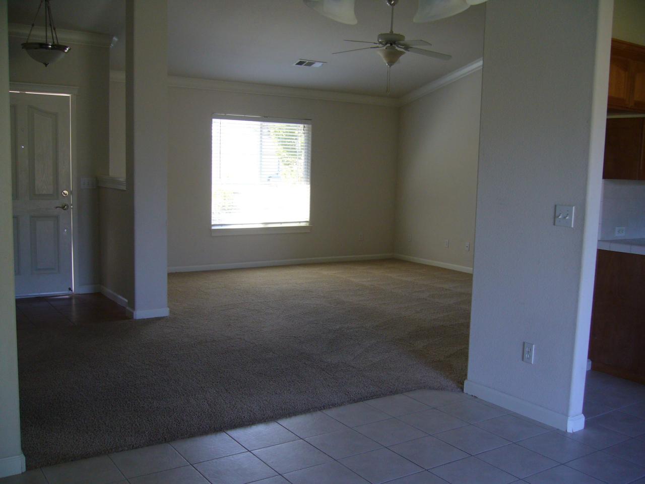 2674 Rhinestone Way Redding, CA 96001 - Photo 5 of 7 an empty room with a empty space and windows