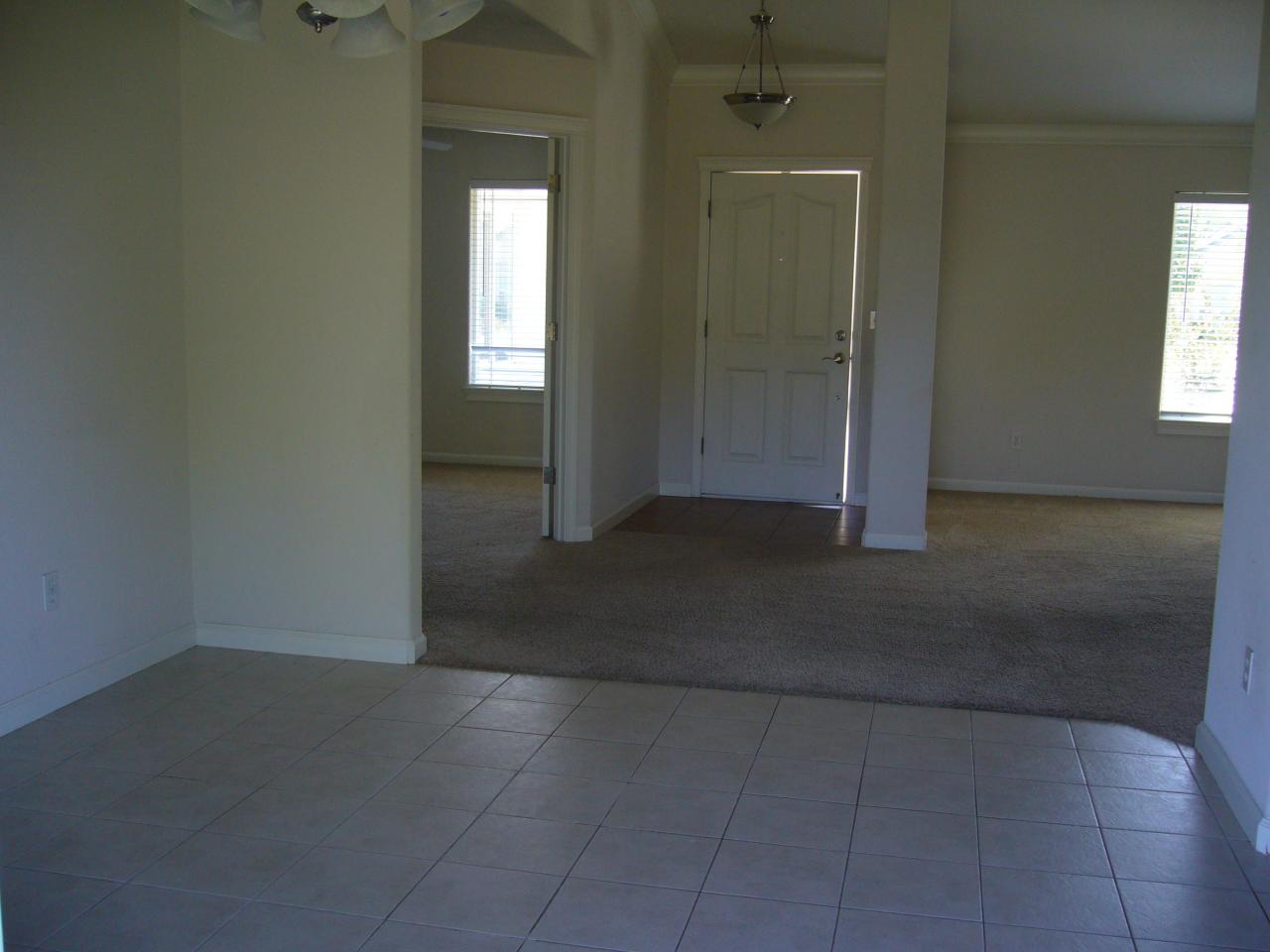 2674 Rhinestone Way Redding, CA 96001 - Photo 6 of 7 an empty room with windows