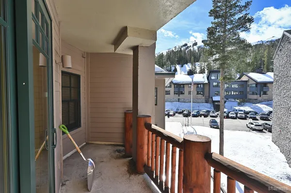 a view of a living room and balcony