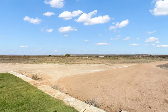 a bathroom with a double vanity sink and mirror