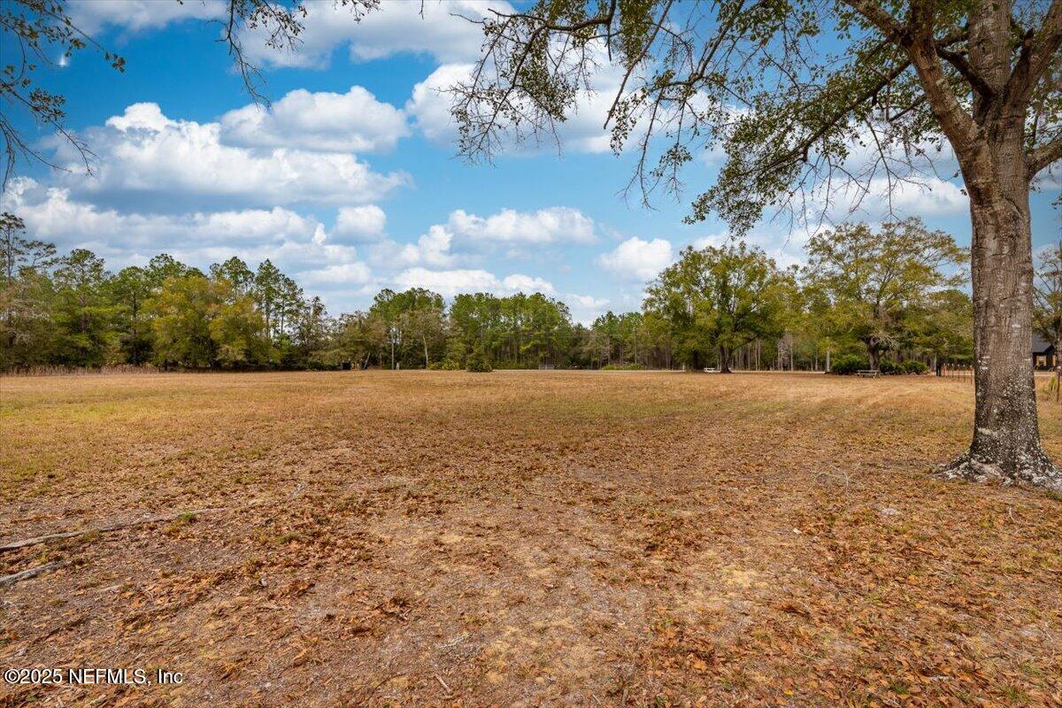 1 Hogarth Road Green Cove Springs, FL 32043 - Photo 4 of 28 a view of yard with swimming pool and green space