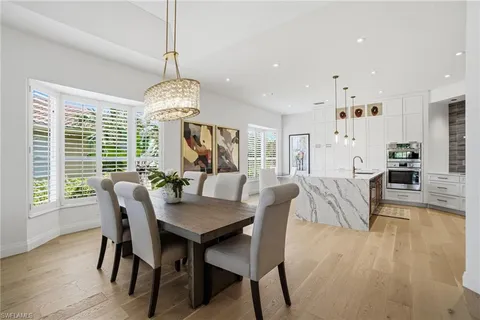 a dining room with furniture window wooden floor