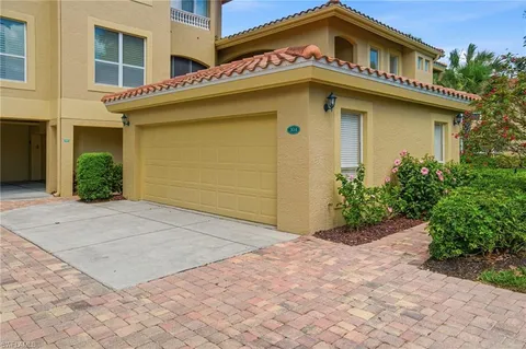 a yellow house with a outdoor space