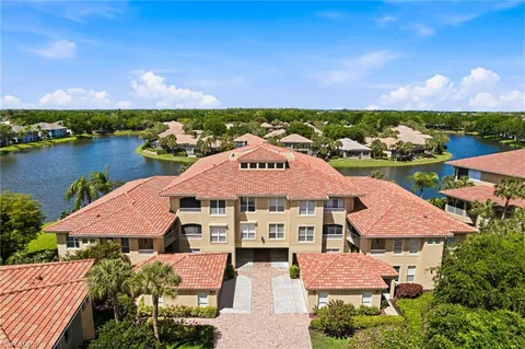 an aerial view of a house with a lake view