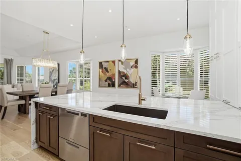 a kitchen with a sink and window