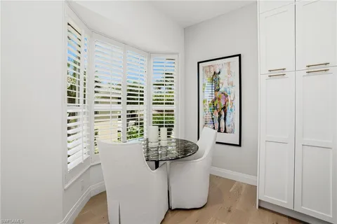 a bathroom with a bathtub and a window