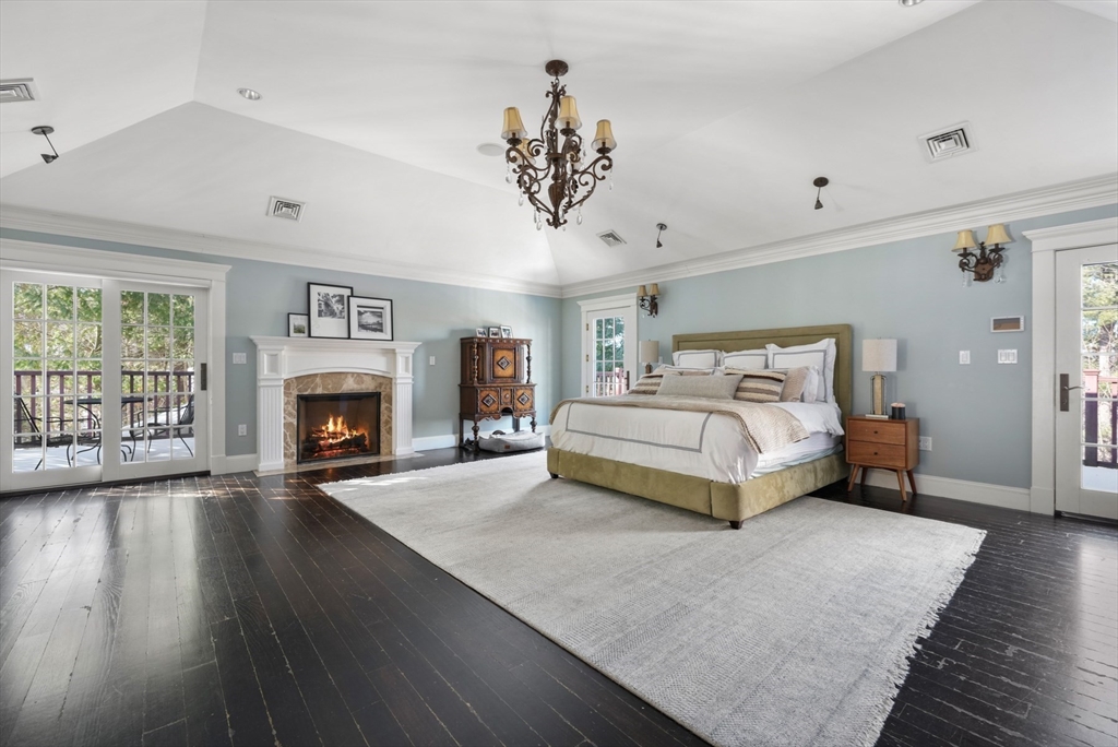 427 Hillside Street Milton, MA 02186 - Photo 20 of 42 a bedroom with a bed and a fireplace