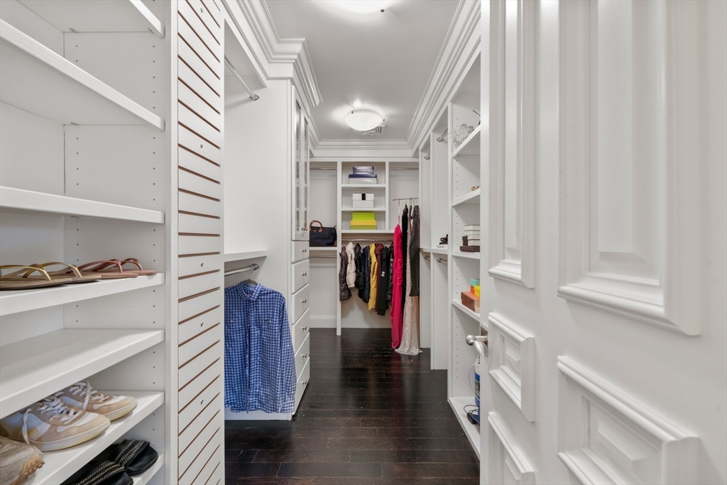 427 Hillside Street Milton, MA 02186 - Photo 23 of 42 a view of walk in closet with clothes and shoes