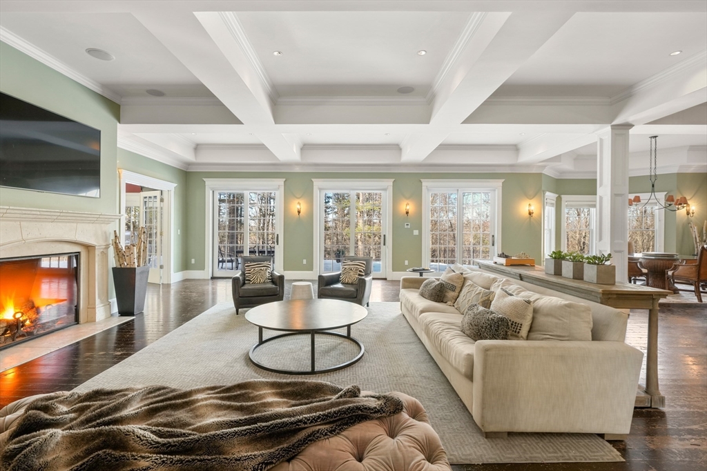 427 Hillside Street Milton, MA 02186 - Photo 6 of 42 a living room with fireplace furniture and a flat screen tv