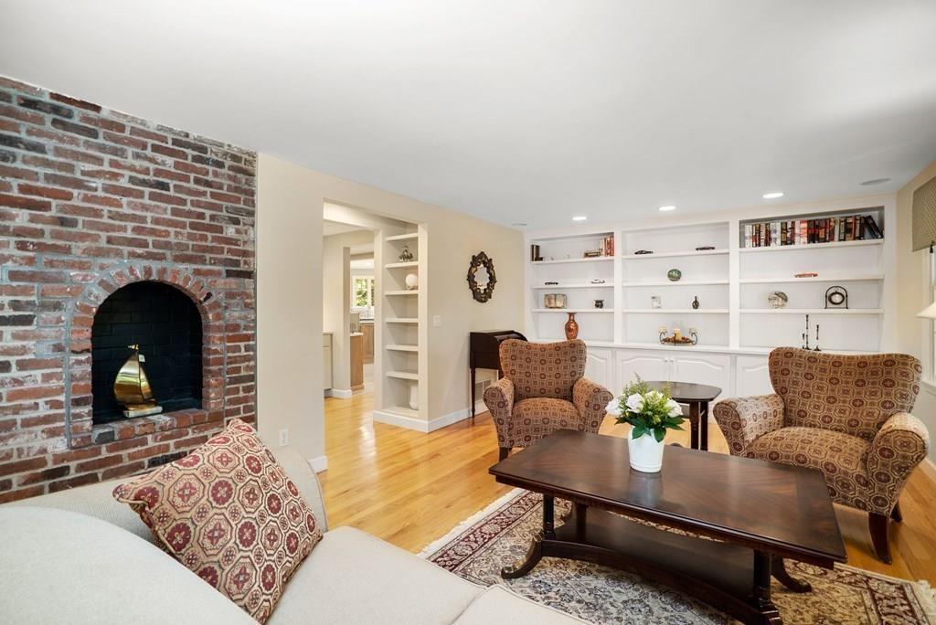 45 3 Ponds Road Wayland, MA 01778 - Photo 8 of 24 a living room with furniture and a fireplace