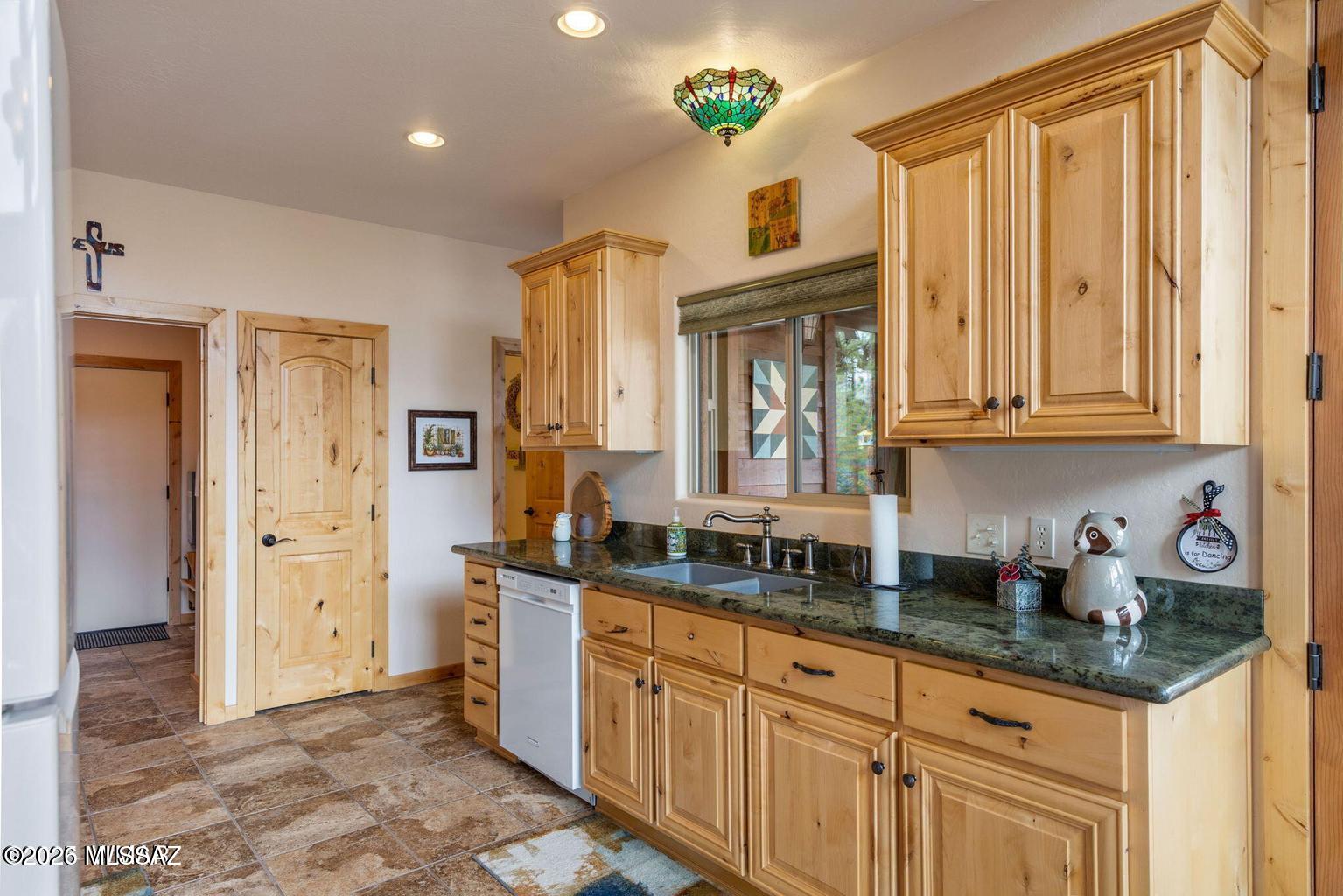 17 2195 Alpine, AZ 85920 - Photo 4 of 48 a kitchen with stainless steel appliances granite countertop a refrigerator and a sink