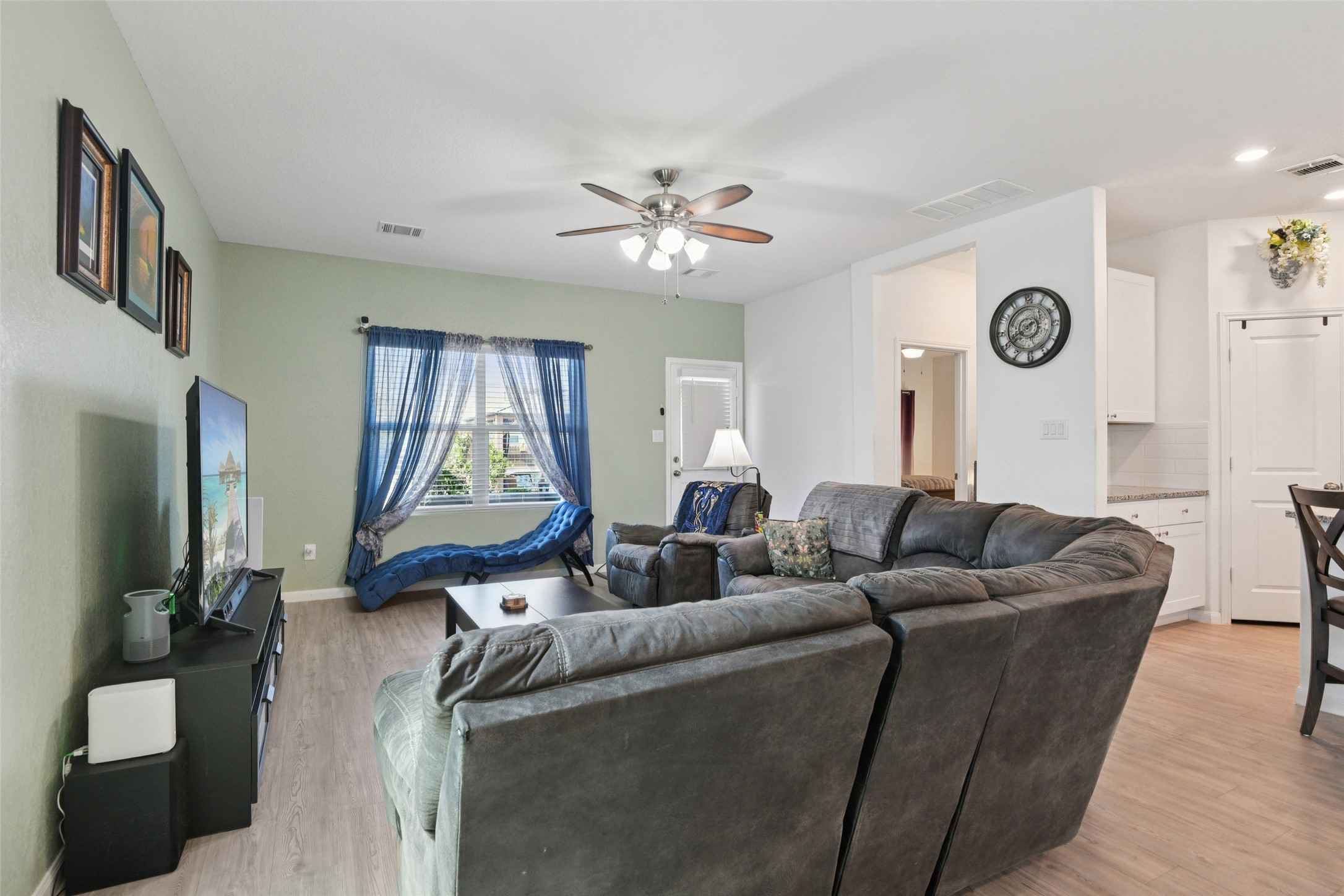 9058 Bowie Ridge Seguin, TX 78155 - Photo 14 of 40 Living room featuring light wood-type flooring and ceiling fan