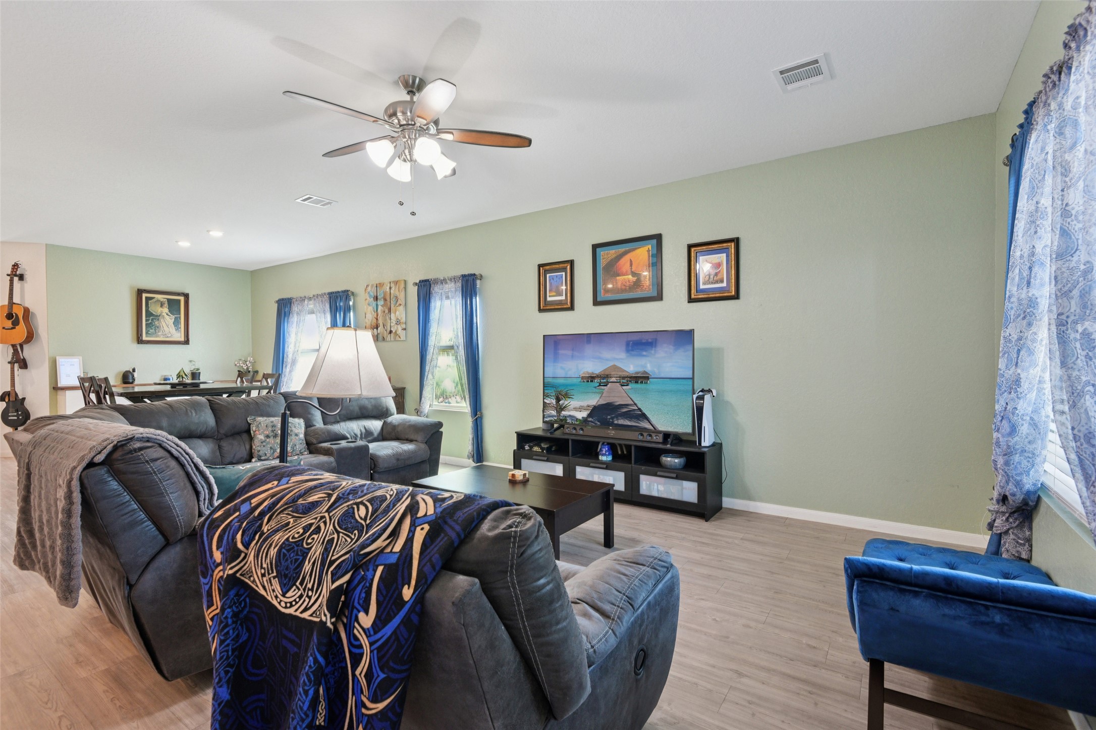 9058 Bowie Ridge Seguin, TX 78155 - Photo 15 of 40 Living area with light wood-type flooring, a ceiling fan, and recessed lighting