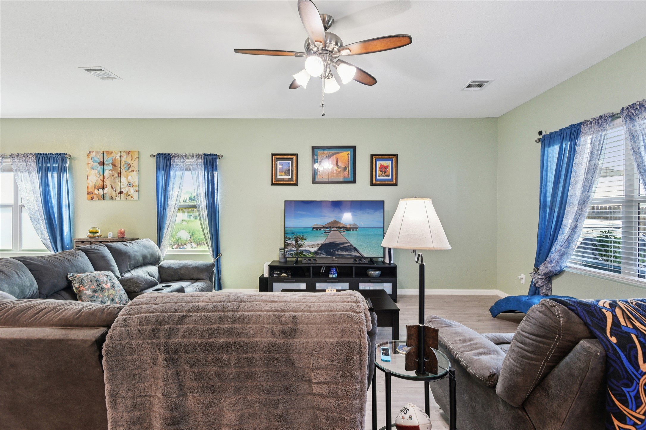 9058 Bowie Ridge Seguin, TX 78155 - Photo 16 of 40 Living area featuring a ceiling fan and wood finished floors