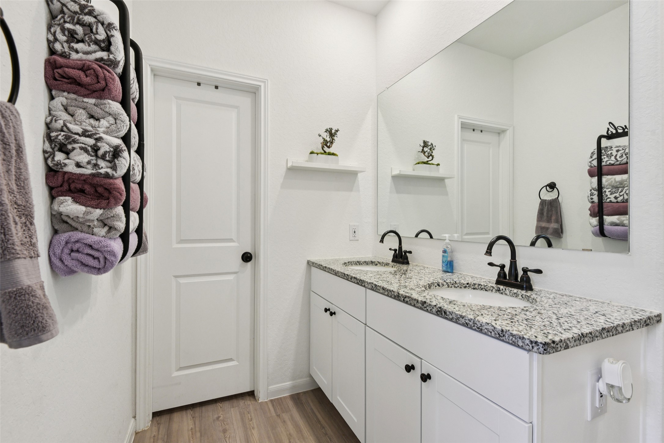 9058 Bowie Ridge Seguin, TX 78155 - Photo 19 of 40 Full bath featuring double vanity and light wood finished floors