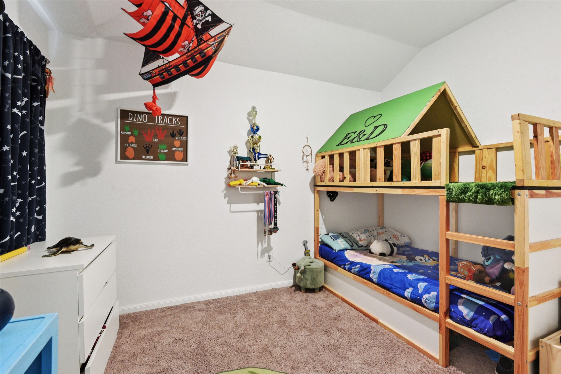 9058 Bowie Ridge Seguin, TX 78155 - Photo 26 of 40 Bedroom with light colored carpet and lofted ceiling