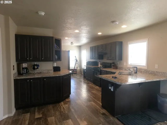 a kitchen with sink cabinets and window