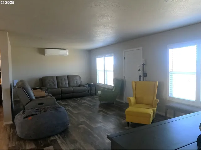 a living room with furniture a window and a couch