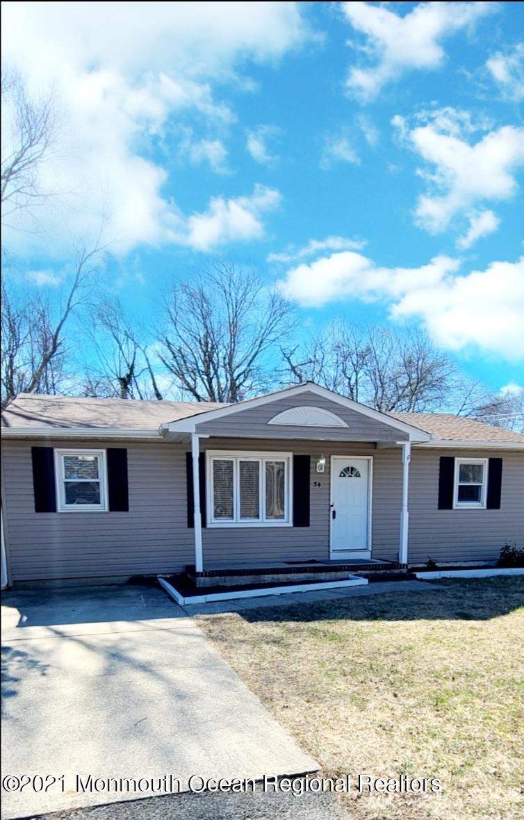 34 Letts Landing Road Waretown, NJ 08758 - Photo 4 of 23 a house view with a backyard space