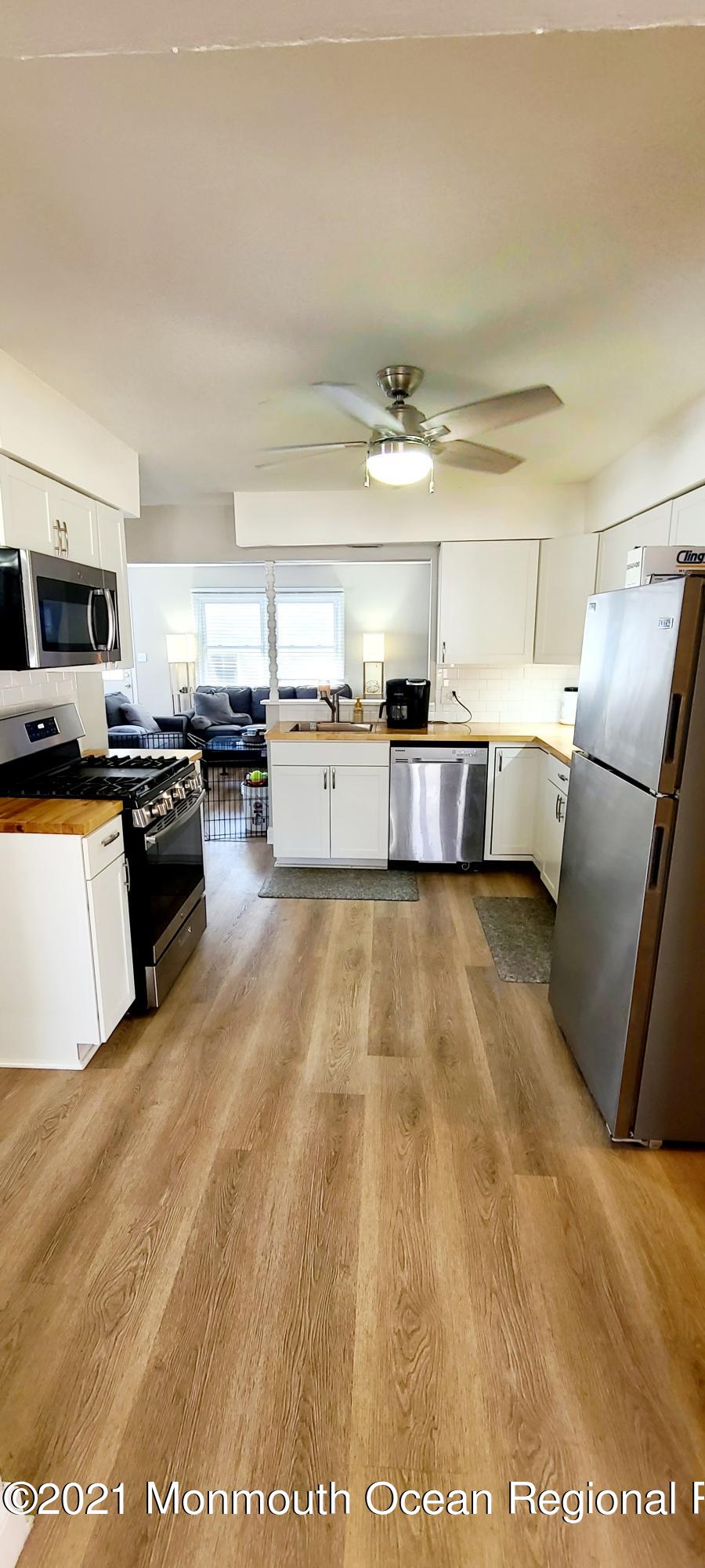 34 Letts Landing Road Waretown, NJ 08758 - Photo 10 of 23 a large kitchen with a stove a sink dishwasher and a refrigerator
