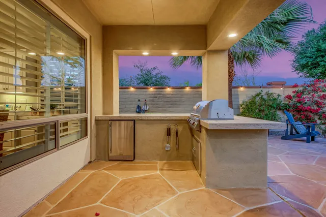 a bathroom with a toilet sink double vanity and mirror