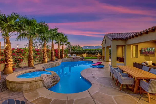 a outdoor living space with furniture and a floor to ceiling window