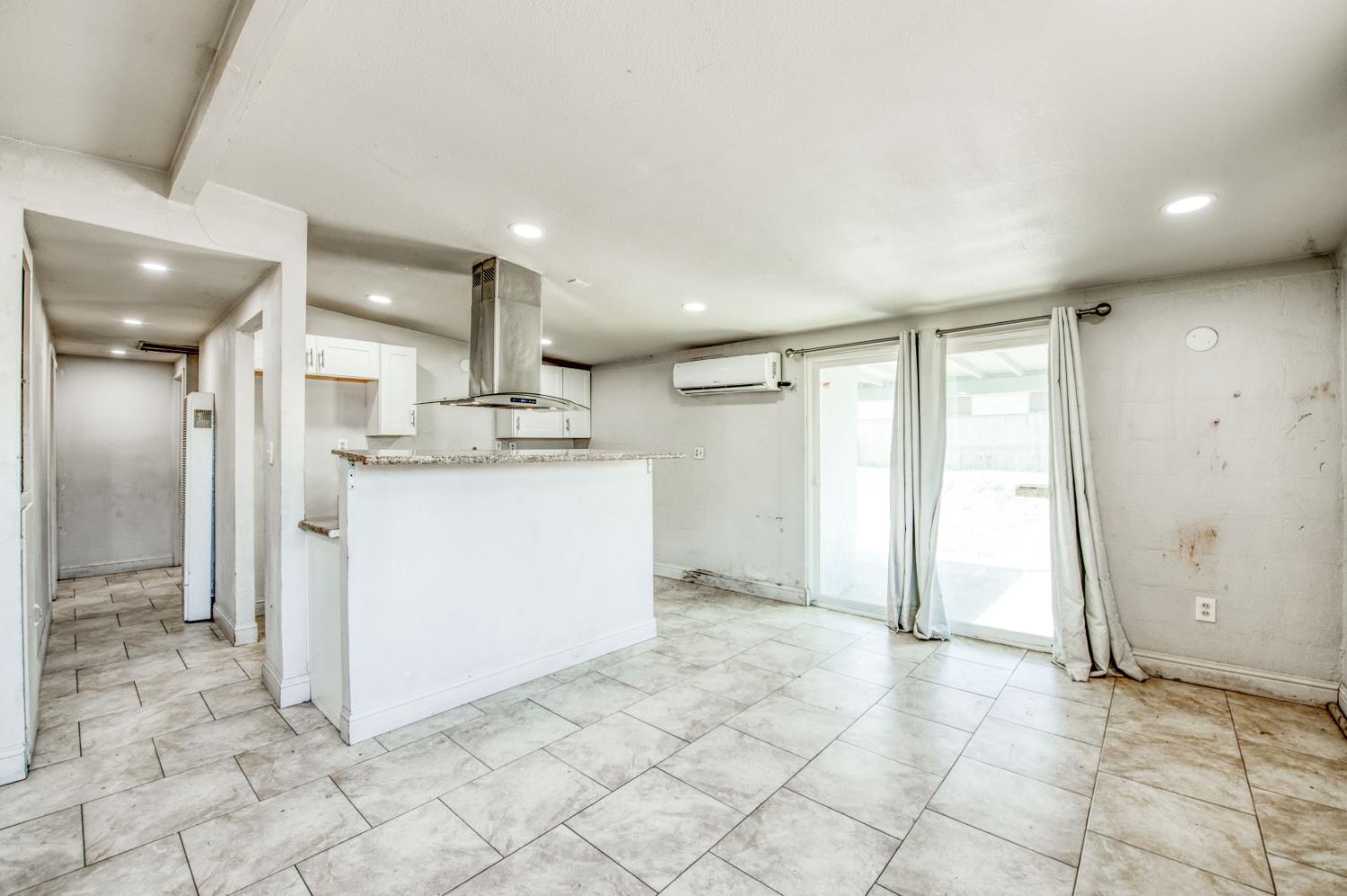 2326 East Hampton Way Fresno, CA 93726 - Photo 5 of 22 a kitchen with stainless steel appliances granite countertop a refrigerator and a sink