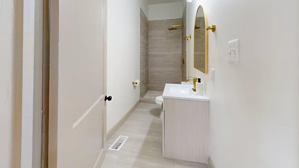 a bathroom with a sink a mirror and a shower