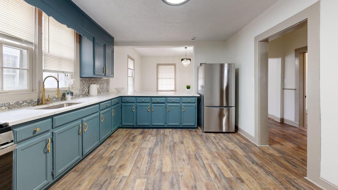 860 Stokes Street Danville, VA 24541 - Photo 30 of 32 a kitchen with stainless steel appliances granite countertop a refrigerator and a sink
