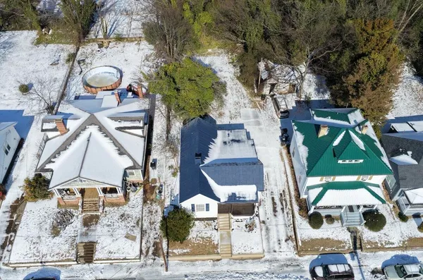 an aerial view of houses with outdoor space