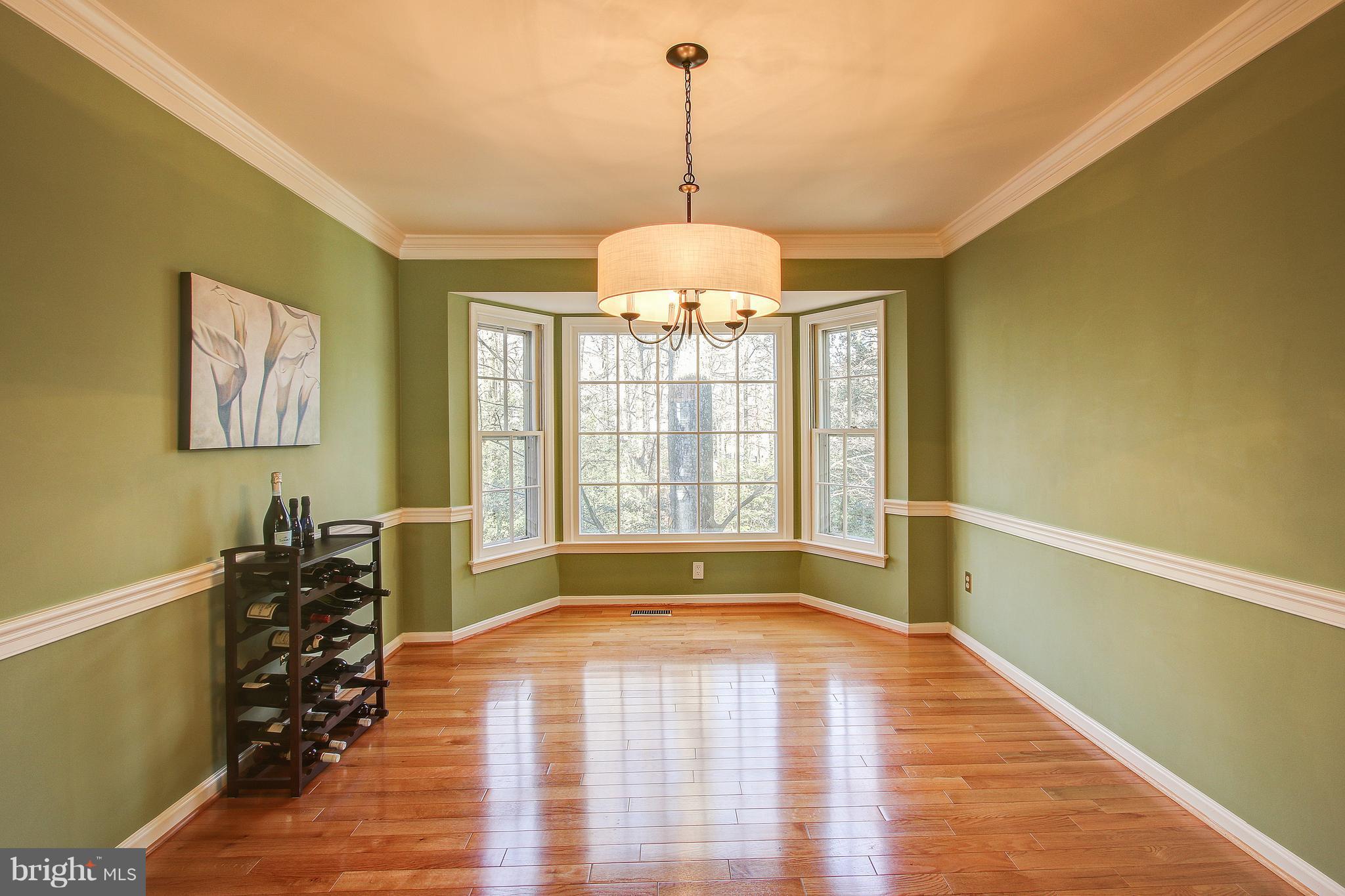Dining Room with bay window overlooking back yard